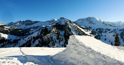 Snowboarder jumping over the hurdle on snow covered mountain Stock Footage