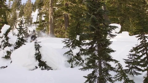 Snowboarder jumping over the snow Stock Footage 77765141