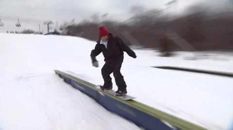 Snowboarder Jumping off Ramp 2 Stock Footage 26068339
