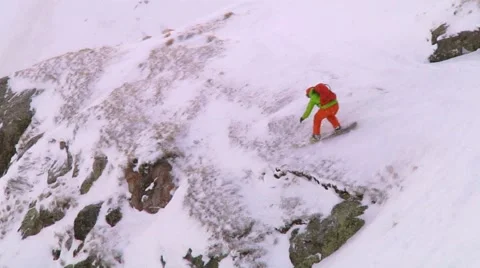 Snowboarder jumping from the slope Stock Footage 60777317