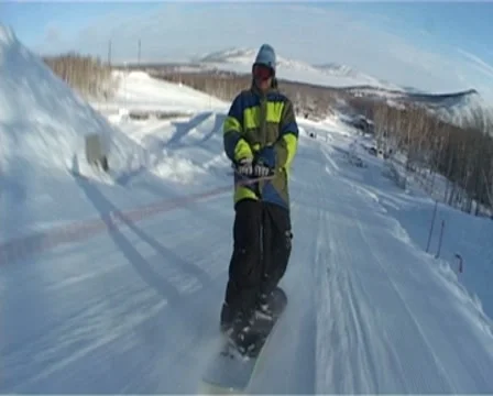 Snowboarder jumping in the snowpark Stock Footage 8966567