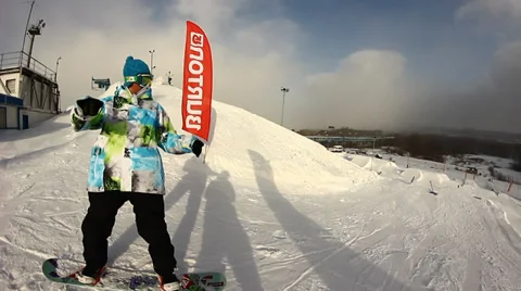 Snowboarder jumps trick Stock Footage 35456144