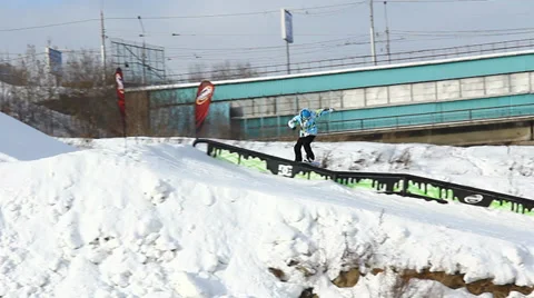 Snowboarder jumps trick Stock Footage 35456572