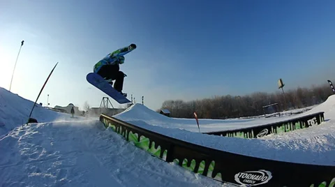 Snowboarder jumps trick Stock Footage 35498301