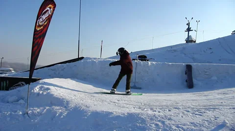 Snowboarder jumps trick Stock Footage 35498318