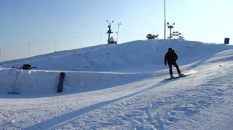 Snowboarder jumps trick Stock Footage 35498382