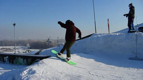 Snowboarder jumps trick Stock Footage 35498475