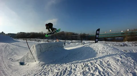 Snowboarder jumps trick Stock Footage 35498482