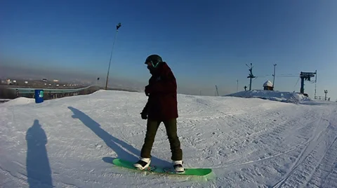 Snowboarder jumps trick Stock Footage 35498574
