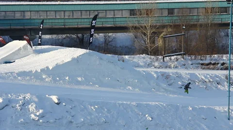 Snowboarder jumps trick Stock Footage 35498941