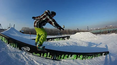 Snowboarder jumps trick Stock Footage 35498942