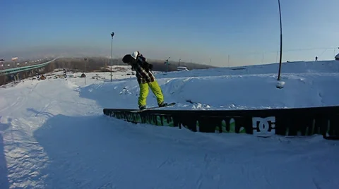 Snowboarder jumps trick Stock Footage 35499006