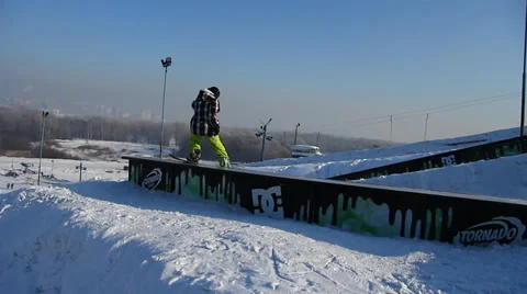 Snowboarder jumps trick Stock Footage 35499019