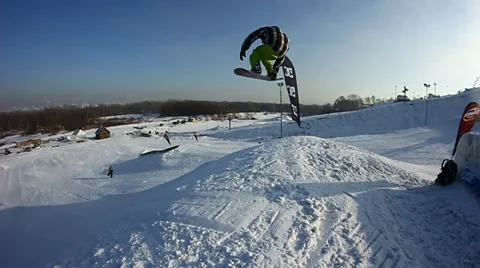 Snowboarder jumps trick Stock Footage 35499026