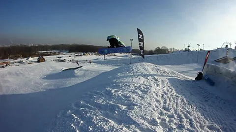 Snowboarder jumps trick Stock Footage 35499062