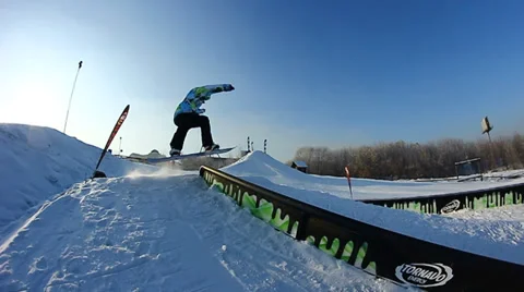 Snowboarder jumps trick Stock Footage 35499067
