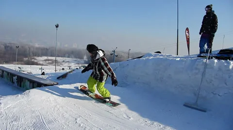 Snowboarder jumps trick Stock Footage 35499099
