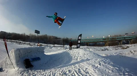 Snowboarder jumps trick Stock Footage 35499105