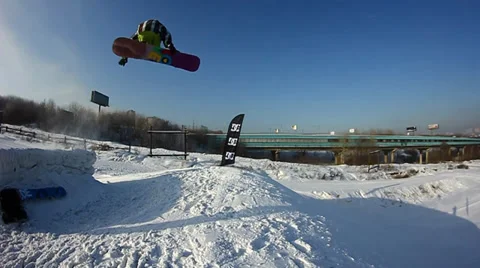 Snowboarder jumps trick Stock Footage 35499122