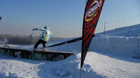 Snowboarder jumps trick Stock Footage 35499136