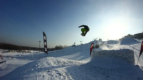 Snowboarder jumps trick Stock Footage 35499145