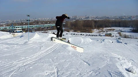 Snowboarder jumps trick Stock Footage 36234000