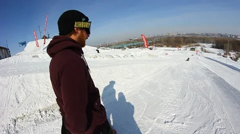 Snowboarder jumps trick Stock Footage 36420643