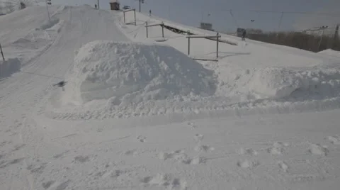 Snowboarder jumps trick Stock Footage 41235573