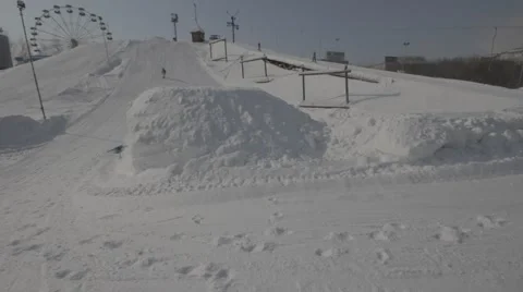 Snowboarder jumps trick Stock Footage 41235574