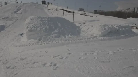 Snowboarder jumps trick Stock Footage 41235628