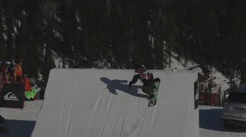 Snowboarder jumps trick Stock Footage 47834885