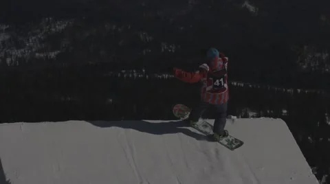 Snowboarder jumps trick Stock Footage 47842054