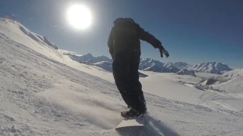 Snowboarder kicks up snow Stock Footage 86482111