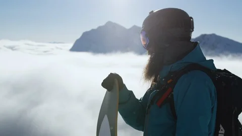 Snowboarder looking at the camera during sunny day Stock Footage 116783943