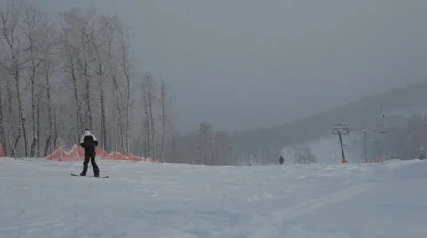 Snowboarder man downhill Stock Footage 59314010