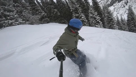 Snowboarder men falling into the deep powder snow Stock Footage 85712317