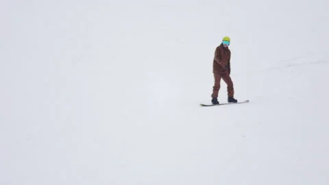 Snowboarder on the mountain Stock Footage 181086356