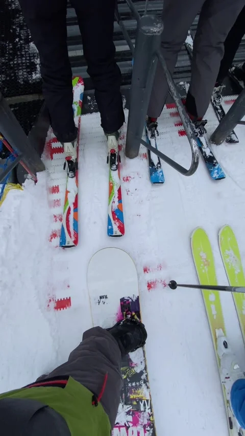 Snowboarder point of view line to ski lift winter vacation Stock Footage 253982630