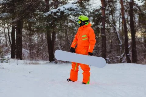 Snowboarder posing in winter forest Stock Photos