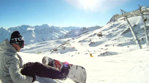 Snowboarder preparing to go downhill Stock Footage 3074738