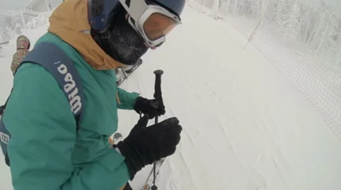 Snowboarder preparing to ride on a slope Stock Footage 68071644
