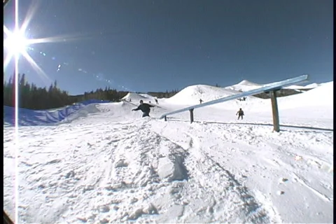 Snowboarder rail slide Stock Footage 352958