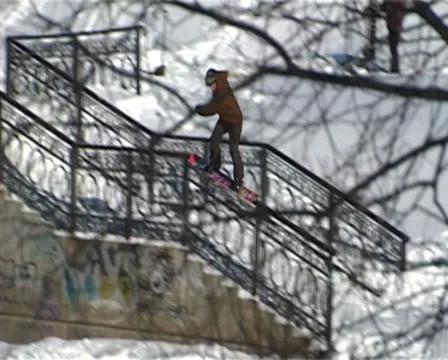 Snowboarder rides on the rails Stock Footage 33747253
