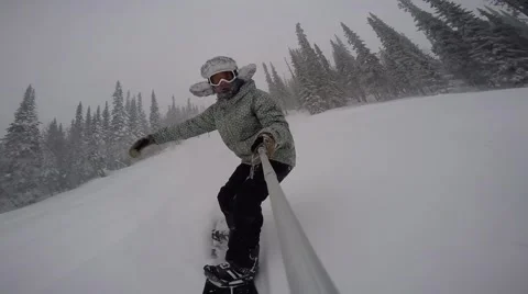 Snowboarder Rides Through the Forest With Fast Speed, Snowboarder Rides Through Stock Footage 67554566