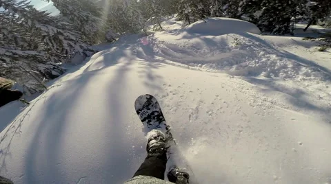 Snowboarder Rides Through the Mountains First-Person View, Snowboarder Takes Stock Footage 63769765