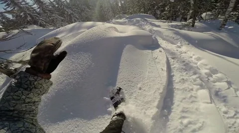 Snowboarder Rides Through the Mountains First-Person View Stock Footage 67554650