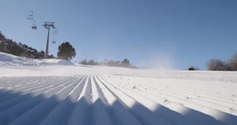 Snowboarder riding down perfect mountain slope. Winter sports, vacation and Stock Footage 255462750