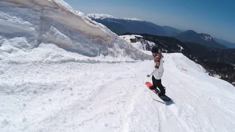 Snowboarder slides down the hill, Rosa Khutor Stock Footage 89419177