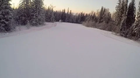 Snowboarder sliding down the mountainside Stock Footage 84219581
