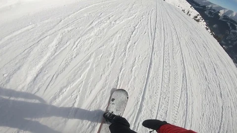 Snowboarder slopes down hill. Action camera is on snowboarder's helmet Stock Footage 120096435